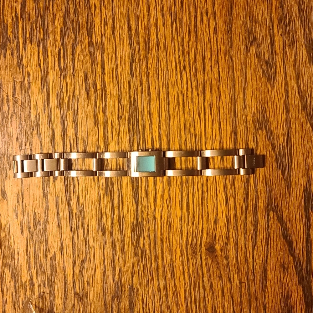 Fossil watch. Silver band with teal face